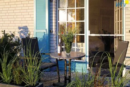 Die Terrasse im Abendlicht Ferienappartements Am Neuensiener See Ferienwohnung 7