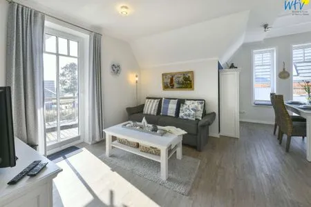 Wohnzimmer Bootshaus in den Dünen - 5 Ferienwohnung 4