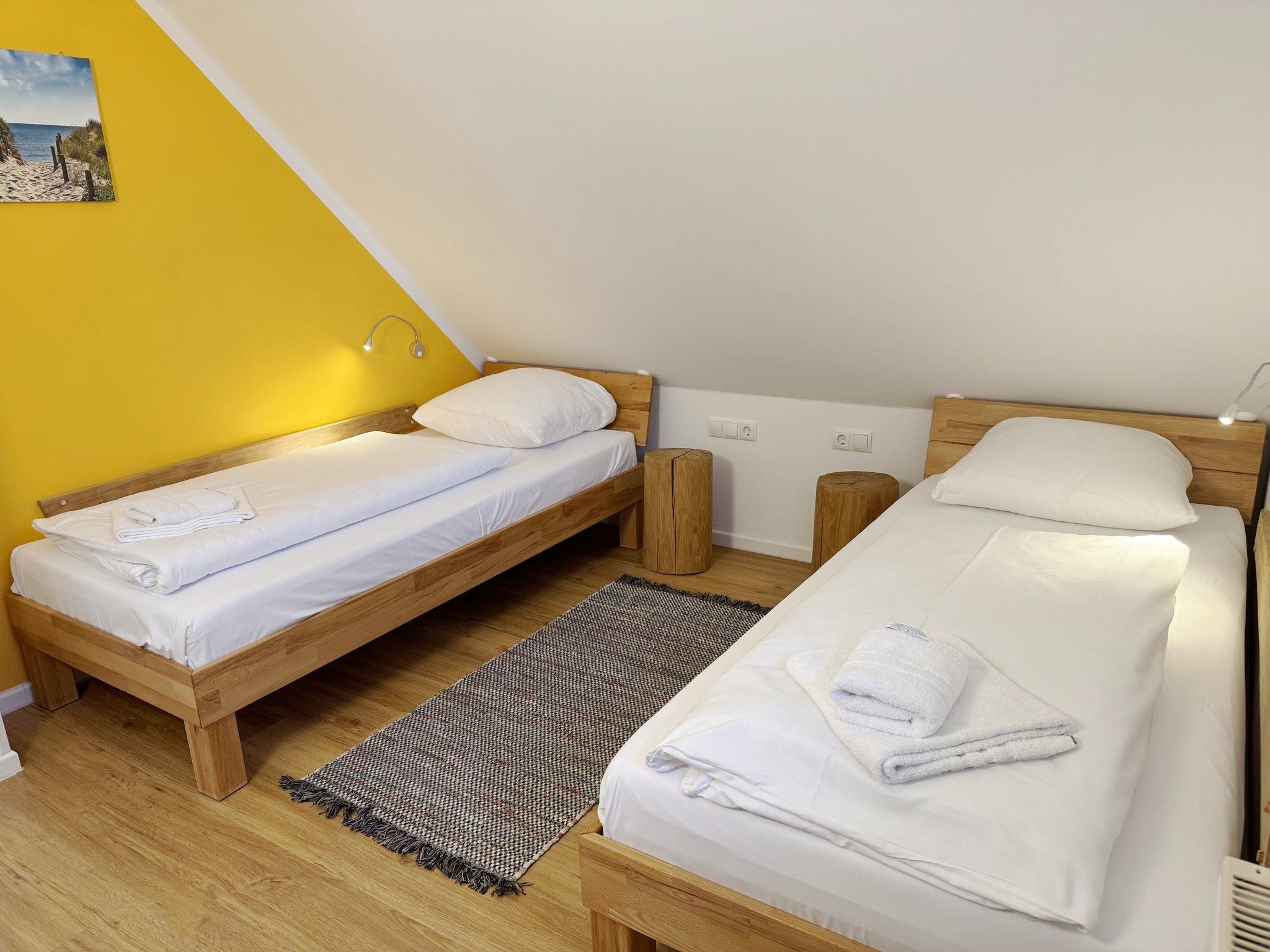 Feriendorf Rugana Komfortplus Ferienwohnung mit 2 Schlafzimmern und Terrasse (A06) Insel Rügen - Schlafzimmer