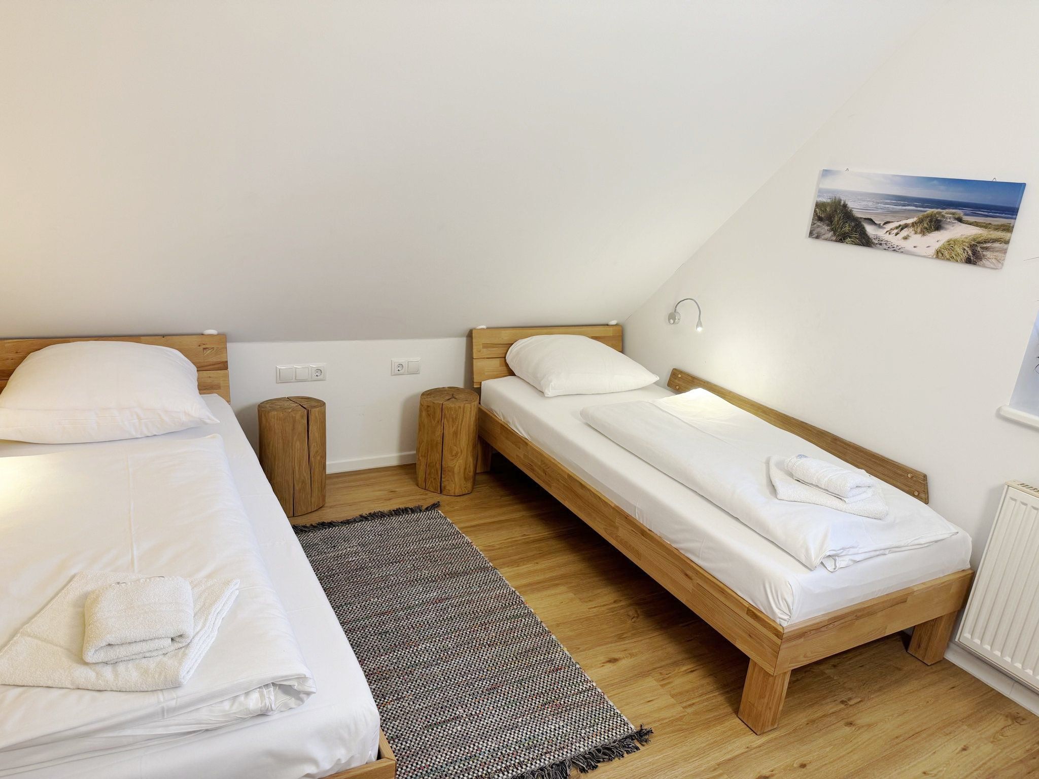 Feriendorf Rugana Komfortplus Ferienwohnung mit 2 Schlafzimmern und Terrasse (A06) Insel Rügen - Schlafzimmer