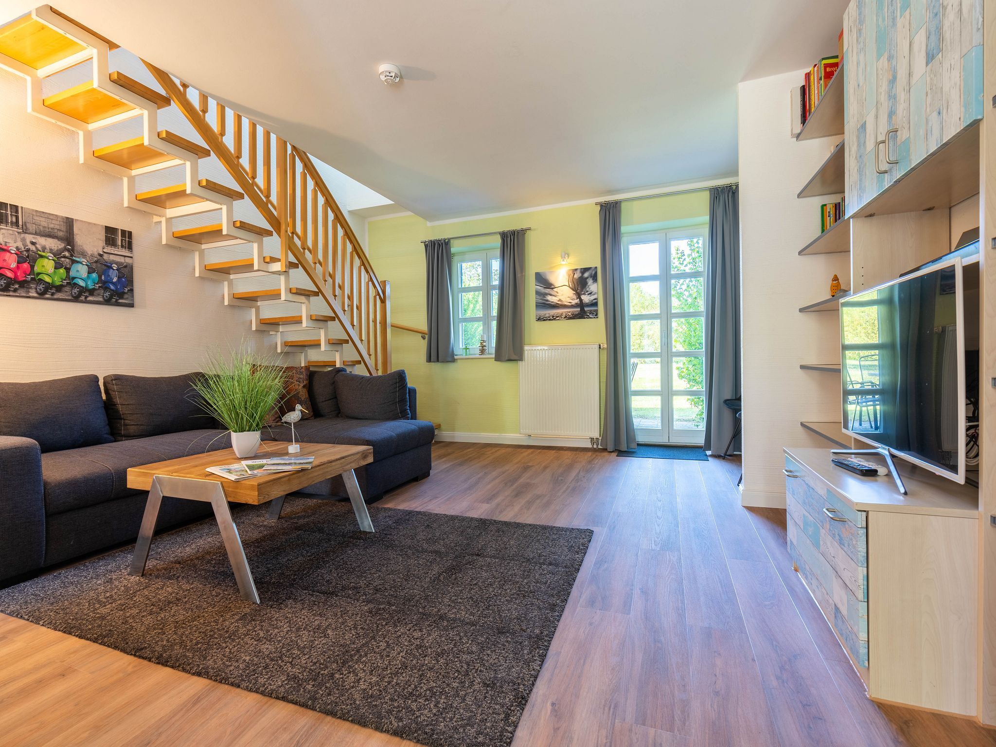 Feriendorf Rugana Komfort Ferienwohnung mit 2 Schlafzimmern und Terrasse (A63) Insel Rügen - Wohnzimmer