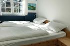Haus Pesel Ferienwohnung *Reetblick* Norddorf auf Amrum - Schlafzimmer mit Doppelbett in der Ferienwohnung Reetblick in Norddorf auf Amrum