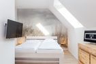  Ferienwohnung 54 Nord Nebel - Schlafzimmerbereich mit einem Doppelbett in der Ferienwohnung 54 Nord in Nebel auf Amrum