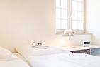  Wattstübchen (Haus Pesel) Norddorf - Gemütliches Doppelbett unter der Dachschräge in der Ferienwohnung Wattstübchen