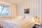  Amrumer Strandhaven Wittdün - Schlafzimmer mit Doppelbett in der Ferienwohnung Amrumer Strandhaven in Wittdün