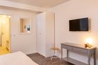 Amrumer Strandhaven Wittdün - Schlafzimmer mit TV in der Ferienwohnung Amrumer Strandhaven in Wittdün