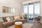  Amrumer Strandhaven Wittdün - Wohnzimmer mit Meerblick in der Ferienwohnung Amrumer Strandhaven in Wittdün