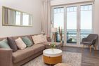  Amrumer Strandhaven Wittdün - Wohnzimmer mit Meerblick in der Ferienwohnung Amrumer Strandhaven in Wittdün
