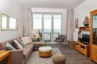  Amrumer Strandhaven Wittdün - Wohnzimmer mit Meerblick in der Ferienwohnung Amrumer Strandhaven in Wittdün