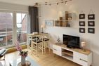 Haus *Südspitze 18* Ferienwohnung Südspitze 18/6 - Meerblick Wittdün auf Amrum - Wohnzimmer der Ferienwohnung Südspitze 18/6 Meerblick in Wittdün auf Amrum