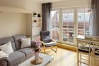 Haus *Südspitze 18* Ferienwohnung Südspitze 18/6 - Meerblick Wittdün auf Amrum - Wohnzimmer der Ferienwohnung Südspitze 18/6 Meerblick in Wittdün auf Amrum