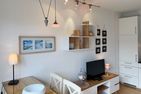 Haus *Südspitze 18* Ferienwohnung Südspitze 18/6 - Meerblick Wittdün auf Amrum - Wohnzimmer der Ferienwohnung Südspitze 18/6 Meerblick in Wittdün auf Amrum