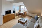 Haus *Südspitze 17* Ferienwohnung *Gaubenkieker* Wittdün auf Amrum - Wohnzimmer in der Ferienwohnung Gaubenkieker des Hauses Südspitze 17 in Wittdün auf Amrum
