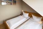 Haus *Südspitze 17* Ferienwohnung *Gaubenkieker* Wittdün auf Amrum - Schlafzimmer in der Ferienwohnung Gaubenkieker des Hauses Südspitze 17 in Wittdün auf Amrum