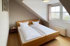 Haus *Südspitze 17* Ferienwohnung *Gaubenkieker* Wittdün auf Amrum - Schlafzimmer in der Ferienwohnung Gaubenkieker des Hauses Südspitze 17 in Wittdün auf Amrum