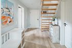 SandWärme Norderney - die insellotsen Norderney / SandWärme - Flur mit Treppe zum Dachgeschoss