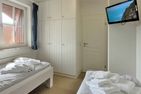  Gmelinstraße 12, Whg. 18, Haus Meeresbrandung Wyk - Schlafzimmer mit TV