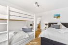  Ferienhaus Captainslodge Olpenitz Ostseeresort Olpenitz - Bett
