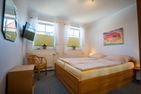 Residenz Rosengrund Wesernest mit Schwimmbad Büsum - Schlafzimmer