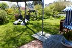 Haus Pesel Ferienwohnung *Reethuk* Norddorf auf Amrum - Terrasse mit Sonnenschirm der Ferienwohnung Reethuk in Norddorf auf Amrum
