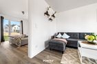  Ferienwohnung Sonnenchalet Olpenitz Ostseeresort Olpenitz - Wohnzimmer