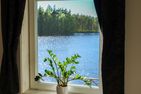  (1) Graues Sommerhaus in Schweden am See mit Boot Smaland - 