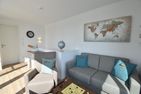  Ferienhaus Meeresmelodie Olpenitz Ostseeresort Olpenitz - Wohnzimmer