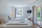  fewo1846 - Lille Loft Glücksburg - Schlafzimmer mit Zugang zur Terrasse