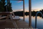  (1) Graues Sommerhaus in Schweden am See mit Boot Smaland - 