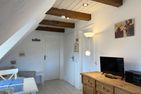 Hüs Sanskiin Ferienwohnung *Driiwholt* Süddorf auf Amrum - Wohnzimmer