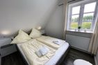  Ferienwohnung Hauke-Haien im Reetdachhaus Bongsiel Dagebüll - Schlafzimmer