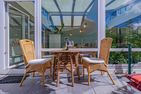  fewo1846 - Nordlicht Harrislee - Sonnige Terrasse mit Gartenmöbeln und Sonnenliegen