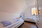 Haus Seeigel Ferienwohnung Strandflieder Norderney - Schlafzimmer