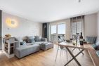  Ferienwohnung LangeBank mit Hafenblick, App. 1, Olpenitz Ostseeresort Olpenitz - Wohnzimmer