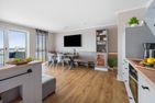  Ferienwohnung LangeBank mit Hafenblick, App. 1, Olpenitz Ostseeresort Olpenitz - Wohnzimmer