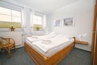 Residenz Rosengrund Wesernest mit Schwimmbad Büsum - Schlafzimmer