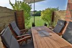  Freundliche Ferienwohnung direkt hinter dem Deich Friedrichskoog-Spitze - Terrasse