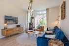  Ferienhaus Reethus bei den Wassern mit Sauna, Kamin und Terrasse Loddin - Wohnzimmer
