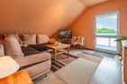  Ferienhaus Albatros mit Terrasse, Balkon und Garten Heringsdorf - Wohnzimmer