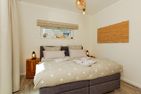  Ferienhaus Reethäus'l mit Whirlpool, Sauna, Kamin und Terrasse Ostseebad Karlshagen - Schlafzimmer