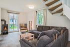  Ferienhaus Seeadler mit Kamin, Sauna und Terrasse Zirchow Fischerdorf - Wohnzimmer
