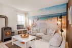  Ferienhaus Golfblick mit Sonnenterrasse und Kamin Korswandt - Wohnzimmer