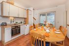  Ferienhaus Rad Kapitän direkt am See mit Sauna und Terrasse Heringsdorf - Küche / Küchenzeile