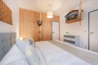  Ferienhaus Rad Kapitän direkt am See mit Sauna und Terrasse Heringsdorf - Schlafzimmer