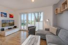  Ferienhaus Anemone mit Kamin und großer Sonnenterrasse Korswandt - Wohnzimmer