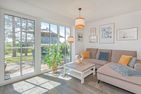  Ferienhaus MeerSeenSucht mit Sauna, Terrasse und Grill Korswandt - Wohnzimmer
