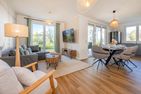  Ferienwohnung Haffmuschel mit Terrasse, Sauna- & Freizeitbereich Zirchow An der Haffküste - Wohnzimmer