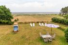  Haus Watthus - Wohnung Himmel Nebel - Garten mit Sonnenliegen, Strandkorb und Sitzplatz im Watthus mit Blick auf das Wattenmeer