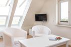  Haus Watthus - Wohnung Himmel Nebel - Wohnzimmer in der Ferienwohnung "Himmel"