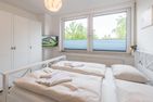 Ferienhaus Glockenstraße Ferienwohnung Ostseehöhe Appartement 2 Scharbeutz - Schlafzimmer